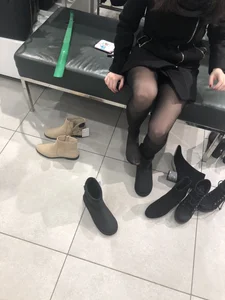Candid teen wearing black pantyhose changing shoes creepshots