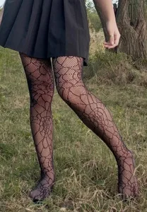 Shoeless Candid Teen's Skinny Legs in Patterned Dark Pantyhose and a Skirt in the Countryside Photo