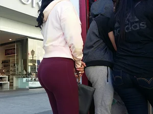 Brunette with a great ass in tight maroon leggings