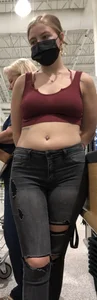 Latina in Maroon crop top and tight black jeans