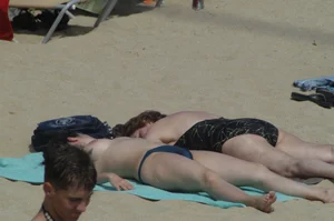 Topless girls on a beach in Barcelona