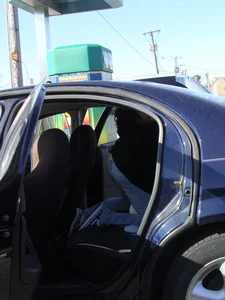 Girls cleaning their cars in jeans and pants