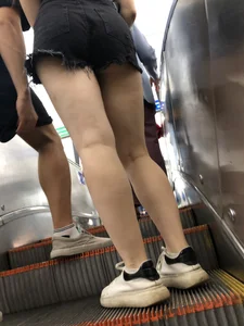 Ok candid legs and booty in black fringed shorts on the subway escalator creepshot