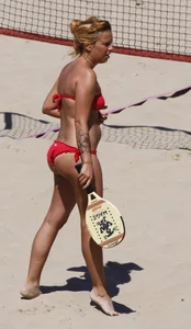 Redhead with nice ass and back dimples in red bikini on the beach
