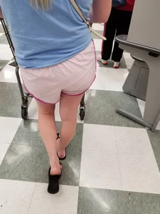 Nice blonde ass in athletic shorts while shopping