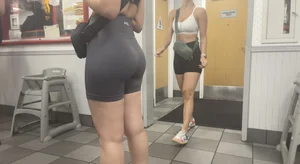 2 gym baddies with nice asses in line