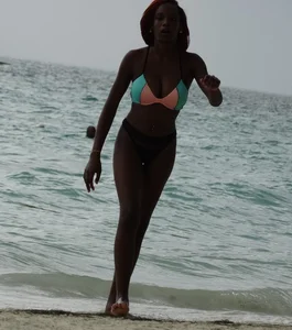 Candid black family, milf and teens on the beach in bikinis
