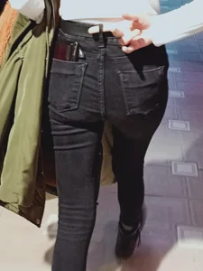 Skinny candid teen girl wearing black jeans street creepshots, closeup of her booty and slim legs