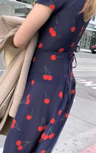 Business women with a visible thong in a see through Cherry Dress