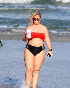 Thick BBW blonde lady in a bikini at the beach