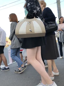 Candid girl wearing a short skirt crossing the street, awesome pale legs