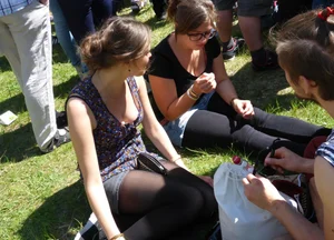 2 sexy girls showing nice cleavage while sitting together