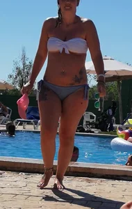Sexy British girl in a bikini at the pool with camel toe