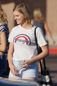 College babe in the parking lot in little denim shorts