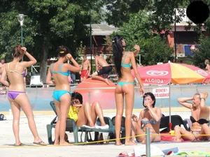 Tall and skinny brunette babe at the pool in a teal thong bikini