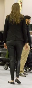 Pretty car saleswoman in tight shiny black pants with nice ass