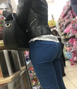 Sexy round bum in tight blue pants