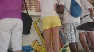 Milf in yellow shorts with vpl and a wedgie