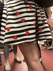 Girl in Striped Dress with Hearts Pattern Skinny Legs Subway Closeup Creepshot