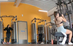 Gym brunette in tight grey shorts