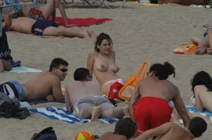 Topless girls on a beach in Barcelona