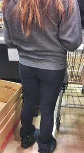 Fit shopping brunette girl in leggings and a hoodie with a nice ass