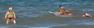Hot surfer chicks out in the water