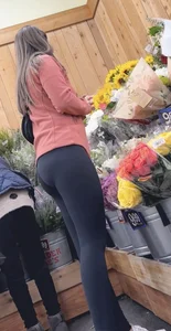 asian round booty looking for flowers at Trader joes
