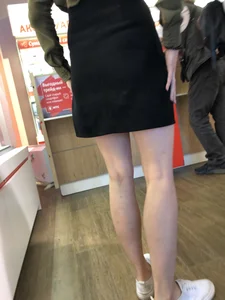 Girl with Pale Skinny Legs in a Skirt Candid