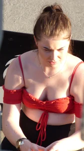 Redhead in little red top showing off her cleavage