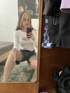 Cute tattooed girl mirror selfies in various clothes