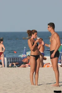 A bunch of sexy beach voyeur babes in bikinis, thongs and topless
