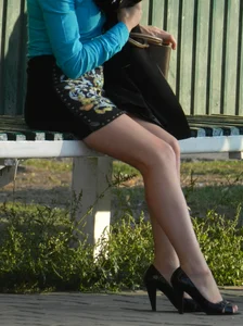 Sexy Milf Sitting on Bus Stop Candid