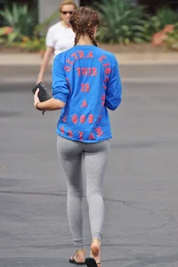 Hot college girl getting food in grey leggings
