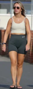 Blonde woman in lycra shorts - good front view, back view ruined by a bag
