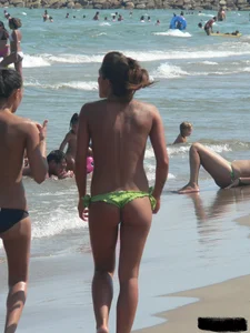 Bunch of sexy babes at the beach in thong bikinis