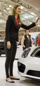 Pretty car saleswoman in tight shiny black pants with nice ass