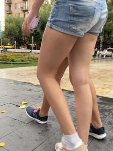 Candid teen wearing denim shorts passing by, nice legs