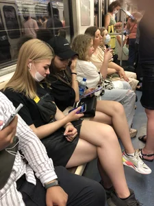 Hot Girls in a Subway Train Sitting With Crossed Legs Closeups And Flashing Booties Under Skirt