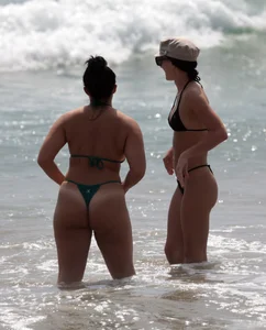 Thick and skinny friends on the beach in thongs