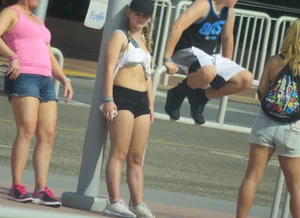 Couple of babes standing around in shorts