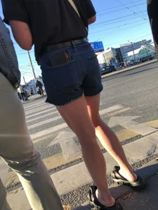 Cute candid teen wearing denim shorts crossing the street, awesome muscly legs