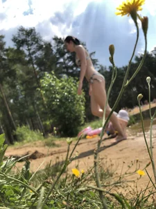 Tall Girl in Swimsuit Walking on a Beach Photos