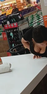 MILF w/ cleavage at checkout
