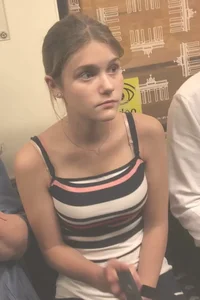 Cute skinny girl in a short dress subway photos
