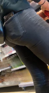 Sexy butt in tight grey jeans with a phone in her back pocket grocery store creepshot