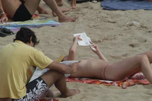 Topless girls on a beach in Barcelona