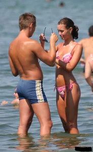 A bunch of sexy beach voyeur babes in bikinis, thongs and topless