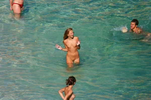 FKK Nudists playing in the water with floater