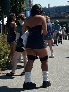 Cheeks hangin’ out of little black skirt